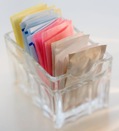 close up of sugar and sweetener packets