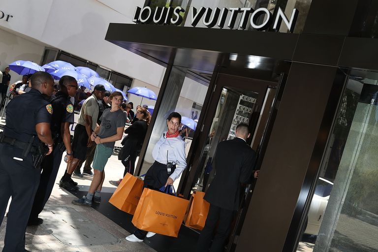 Crowds Line Up For Limited Edition Supreme And Louis Vuitton Collaboration Clothing Items