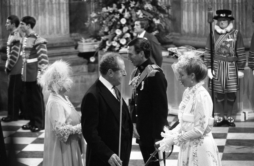 the queen mother, left, speaking with captain mark phillips, the husband of princess anne, right, at the wedding of the prince of wales and lady diana spencer at st pauls cathedral   photo by pa images via getty images