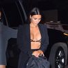 Kim Kardashian barely contains her assets in sheer Gucci braadding  velvet leggings and blazer for dinner in NYC