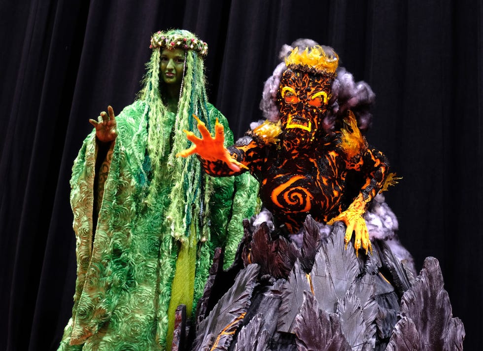 fans and cosplayers dress as te ka and te fiti from moana