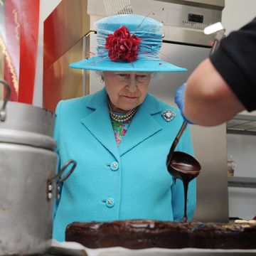 cumbria, england   june 5 no publication in uk media for 28 days queen elizabeth ii watches as a cook from the pie mill makes a chocolate cake at the cumbrian rural enterprise agency on june 5, 2008 in cumbria, england photo by pool tim graham picture librarygetty images