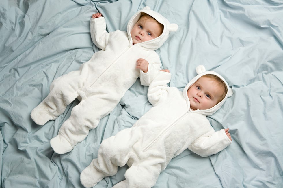 twin babies dressed as polar bears