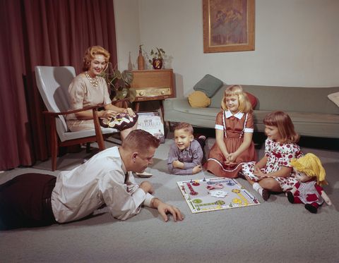 a young family playing ludo with their dad while the mother crochets, 1962 photo by harold m lambertgetty images