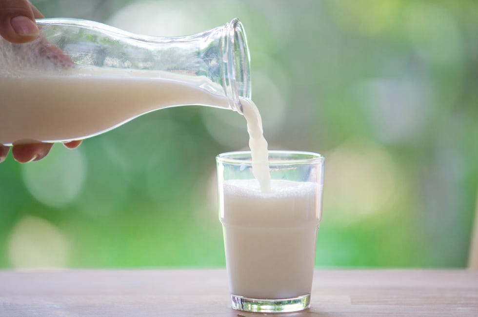 Milk bottle pouring to glass