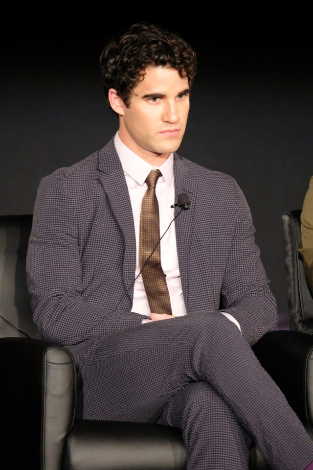 Suit, Formal wear, White-collar worker, Sitting, Blazer, Outerwear, Model, Tuxedo, Muscle, Photography, 