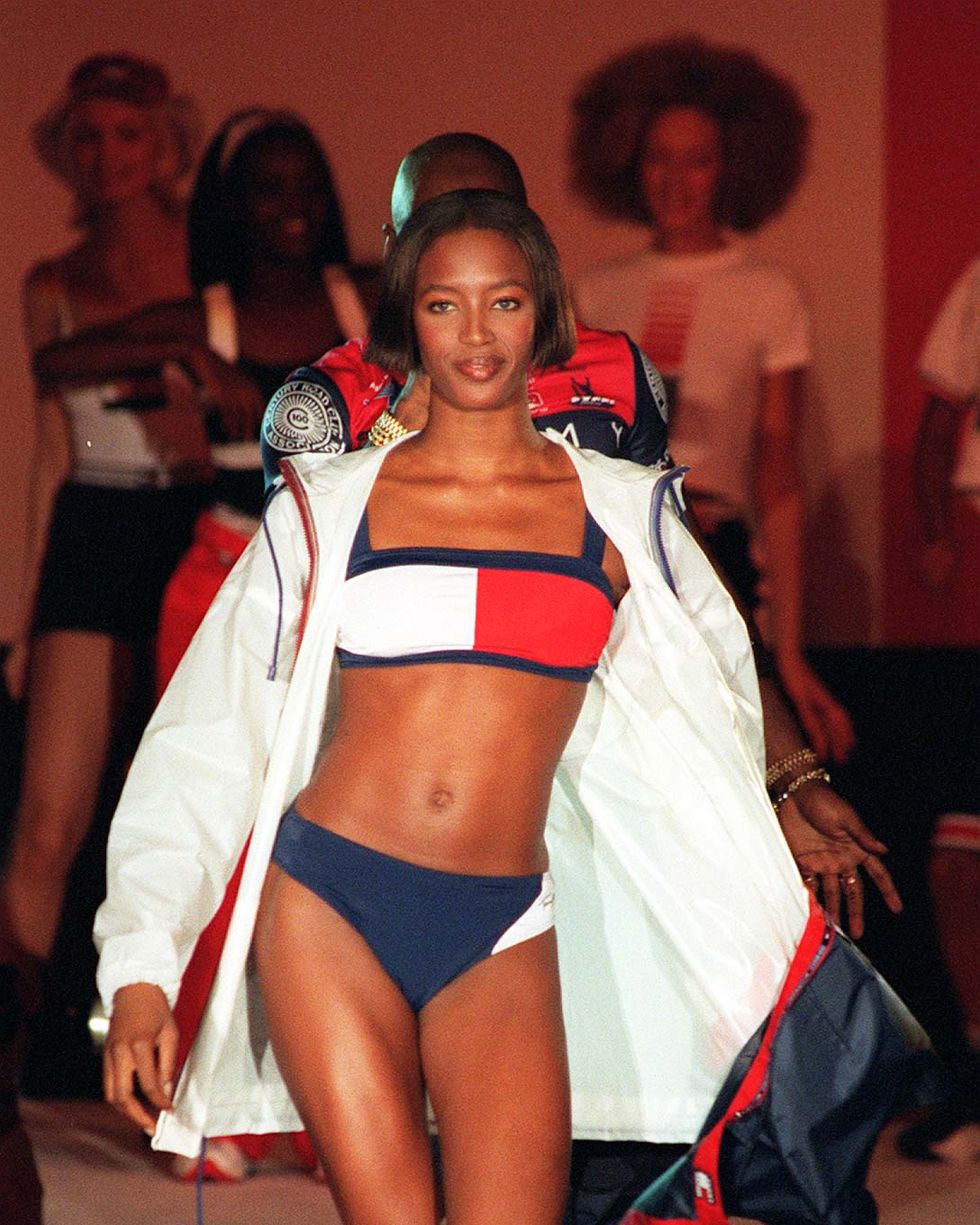 supermodel naomi campbell models a jacket and bikini in designer tommy hilfiger's trademark colours during the presentation of his springsummer 1997 collection at london fashion week this evening saturday photo by neil munnspa   photo by neil munns   pa imagespa images via getty images
