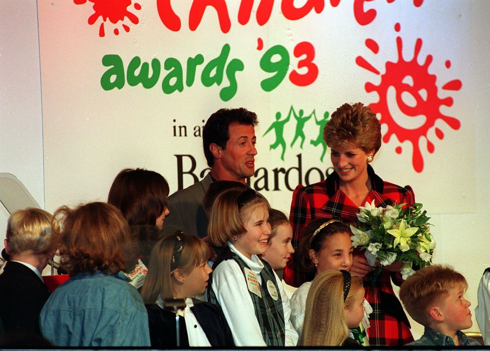 Princess Diana chats with Sylvester Stallone at the Champion Children Awards held at London's Dorchester Hotel.