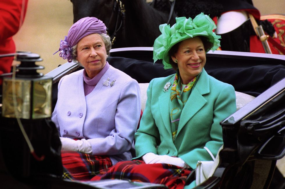 Queen Elizabeth II (L) and Princess Margaret arriving by carriage at Horse Guards Parade, London in May 1993