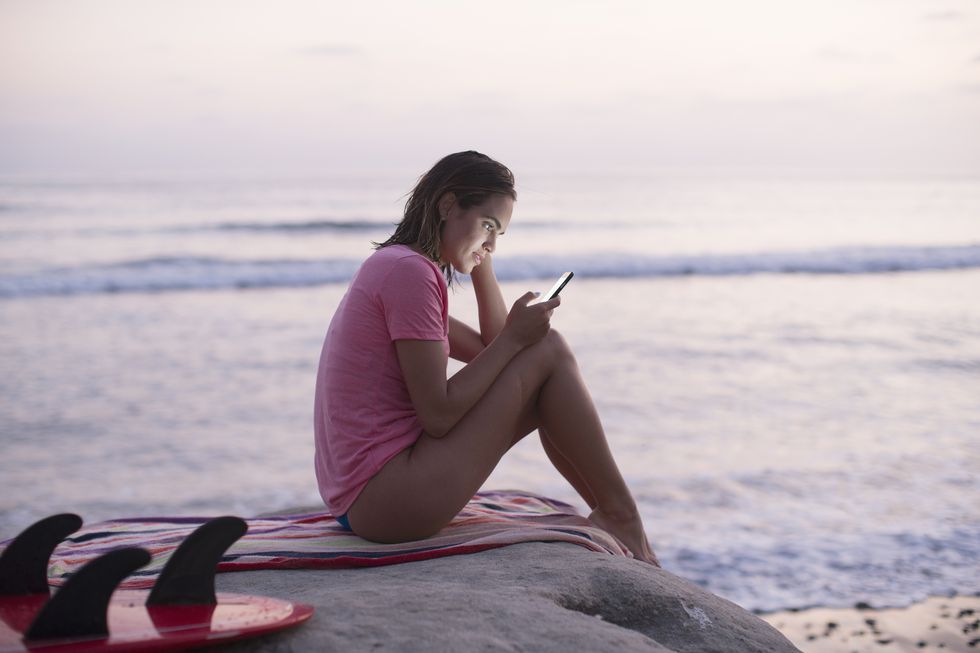 Sitting, Pink, Sea, Beach, Vacation, Technology, Ocean, Photography, Electronic device, Leisure, 