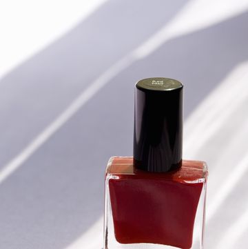 Nail polish, Red, Cosmetics, Glass bottle, Product, Maroon, Nail care, Bottle, Liquid, Material property, 