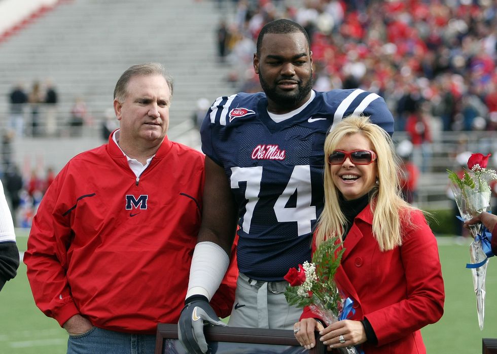 michael oher stands with his family during senior ceremonies prior to a game against the mississippi state bulldogs at vaught hemingway stadium on november 28, 2008, in oxford, mississippi