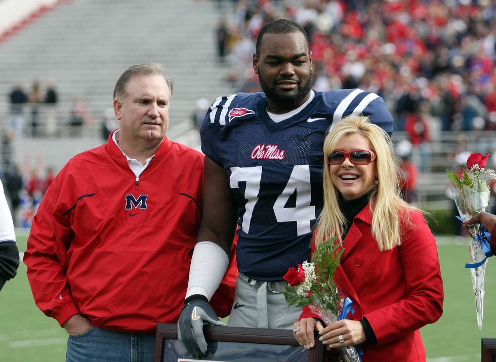 michael oher stands with his family during senior ceremonies prior to a game against the mississippi state bulldogs at vaught hemingway stadium on november 28, 2008, in oxford, mississippi