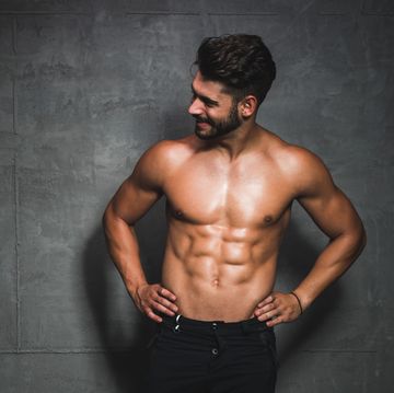 shot of a handsome and muscular young man posing shirtless in the studio
