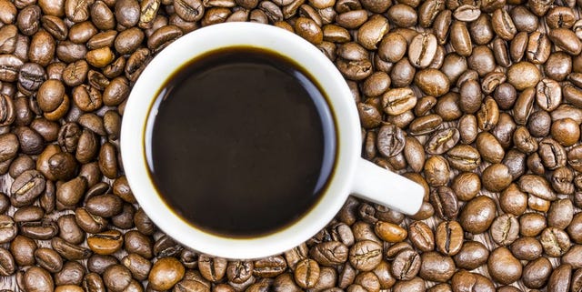 Cup coffee with coffee beans