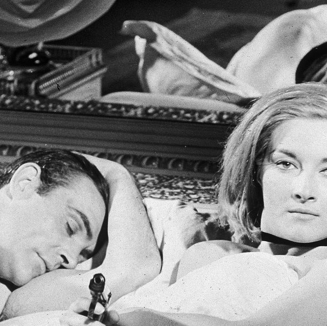 scottish actor sean connery lies in bed with italian actress daniela bianchi in a still from the james bond film 'from russia with love', directed by terence young, 1963 photo by archive photosgetty images
