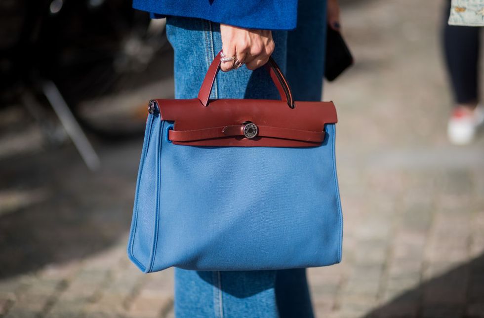 stockholm, sweden   august 30 a guest wearing a blue hermes bag outside by malina on august 30, 2017 in stockholm, sweden photo by christian vieriggetty images