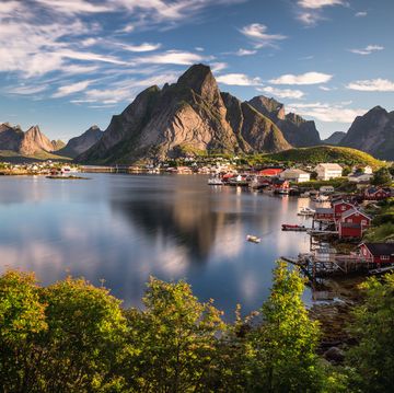view on reine, a small fishing village on lofoten islands, as seen during sunrise in august captured in norway