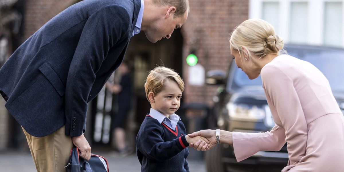 Britain's Prince George (C) accompanied by Britain's Prince William (L), Duke of Cambridge arrives for his first day of school at Thomas's school in Battersea where he is met by Helen Haslem (R) head of the lower school. 