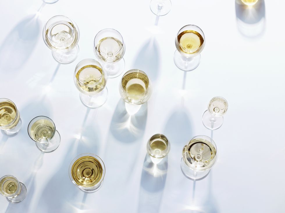 overhead shot of white wine in glasses