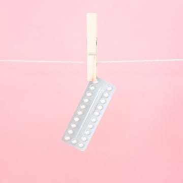 Contraceptive pill blister pack hanging from line