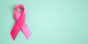 pink ribbon breast cancer on a blue background. top view  top. Place for text