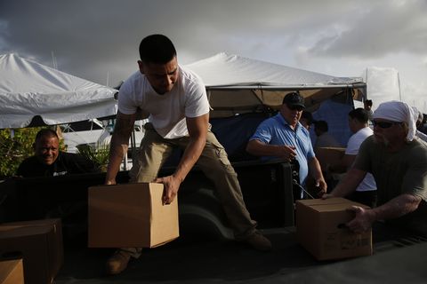 A group of volunteers in Puerto Rico pack supplies for St. Thomas.​