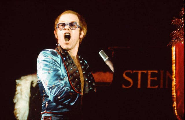 Elton John Sunglasses Photos - 50 Years of Elton John's Fabulously