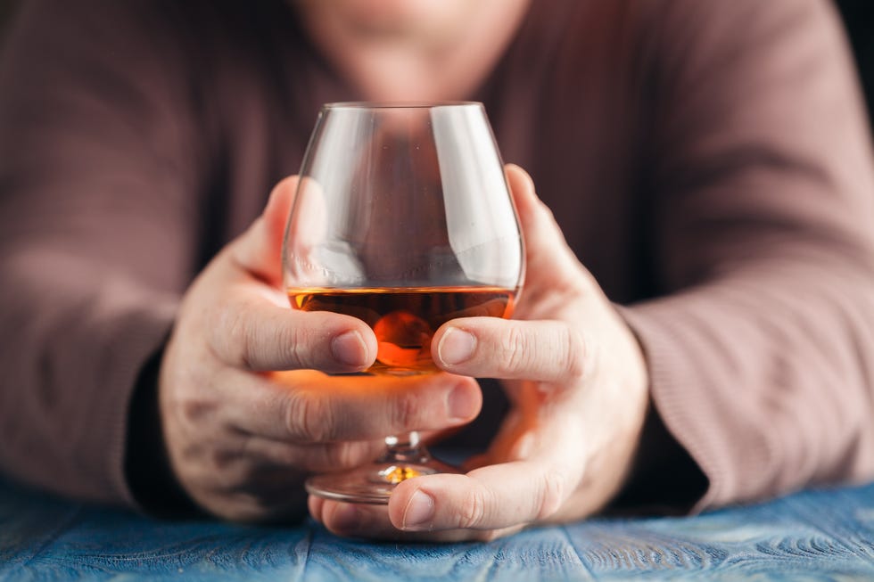 Alcohol, Drink, Hand, Glass, Alcoholic beverage, Snifter, Drinkware, Distilled beverage, Wine glass, Stemware, 