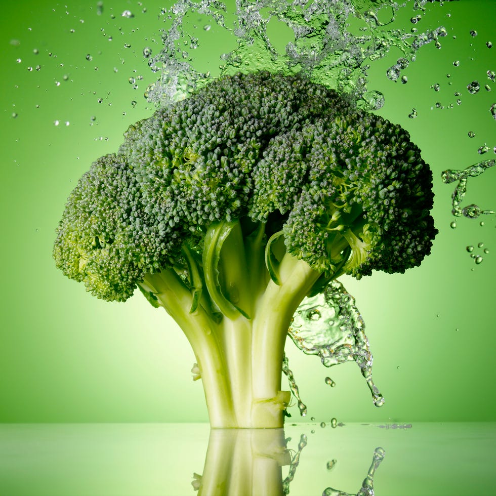 Broccoli Splash broccoli on green background with water splash