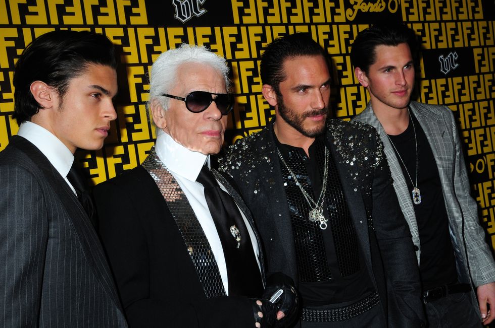 paris, france   march 12 top model baptiste giabiconi, fashion designer karl lagerfeld, his secretary model sebastien jondeau and a guest attend the gossip concert party hosted by fendi at the vip room thater  on march 12, 2009 in paris, france  photo by foc kanwireimage