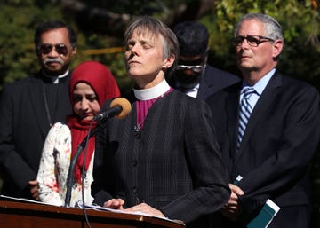 washington, dc october 03 rev mariann budde, bishop of the episcopal diocese of washington leads a group of local religious leaders from many faiths in prayer during a vigil to protest gun laws in the wake of the mass shooting in las vegas, in the bishops garden at the national cathedral on october 3, 2017 in washington, dc photo by mark wilsongetty images
