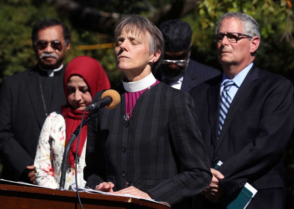 washington, dc october 03 rev mariann budde, bishop of the episcopal diocese of washington leads a group of local religious leaders from many faiths in prayer during a vigil to protest gun laws in the wake of the mass shooting in las vegas, in the bishops garden at the national cathedral on october 3, 2017 in washington, dc photo by mark wilsongetty images