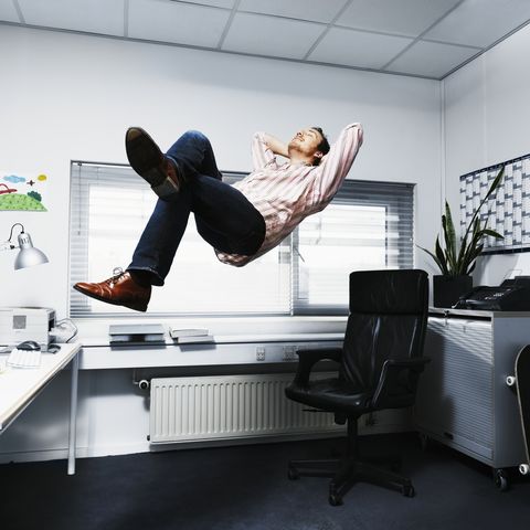 man floating in his office