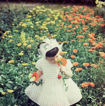 a girl in a field of flowers