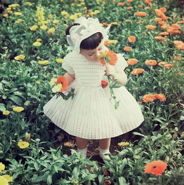 a girl in a field of flowers