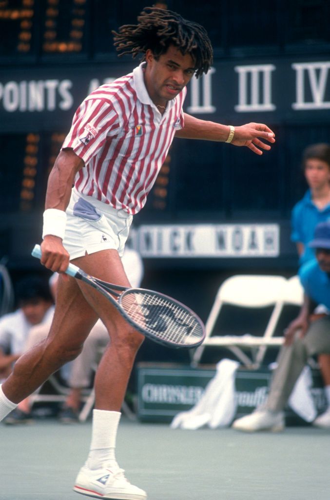 jericho, ny august 28 yannick noah of france hits the backhand during a match against andre agassi in the norstar hamlet challenge cup on august 28, 1988 in jericho, new york photo by bruce bennett studios via getty images studiosgetty images