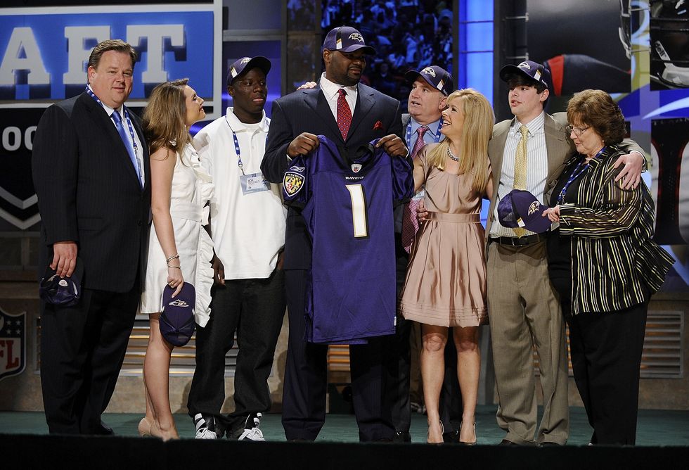 Michael Oher poses for a photograph with his family at Radio City Music Hall for the 2009 NFL Draft on April 25, 2009, in New York City