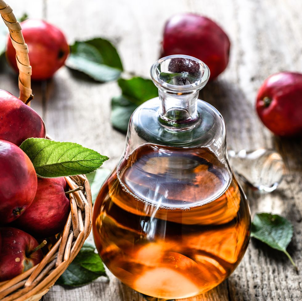 apple vinegar or cider, bottle of drink and apples, healthy organic food concept