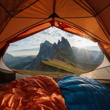 View from tent to the mountain. Sport and active life concept