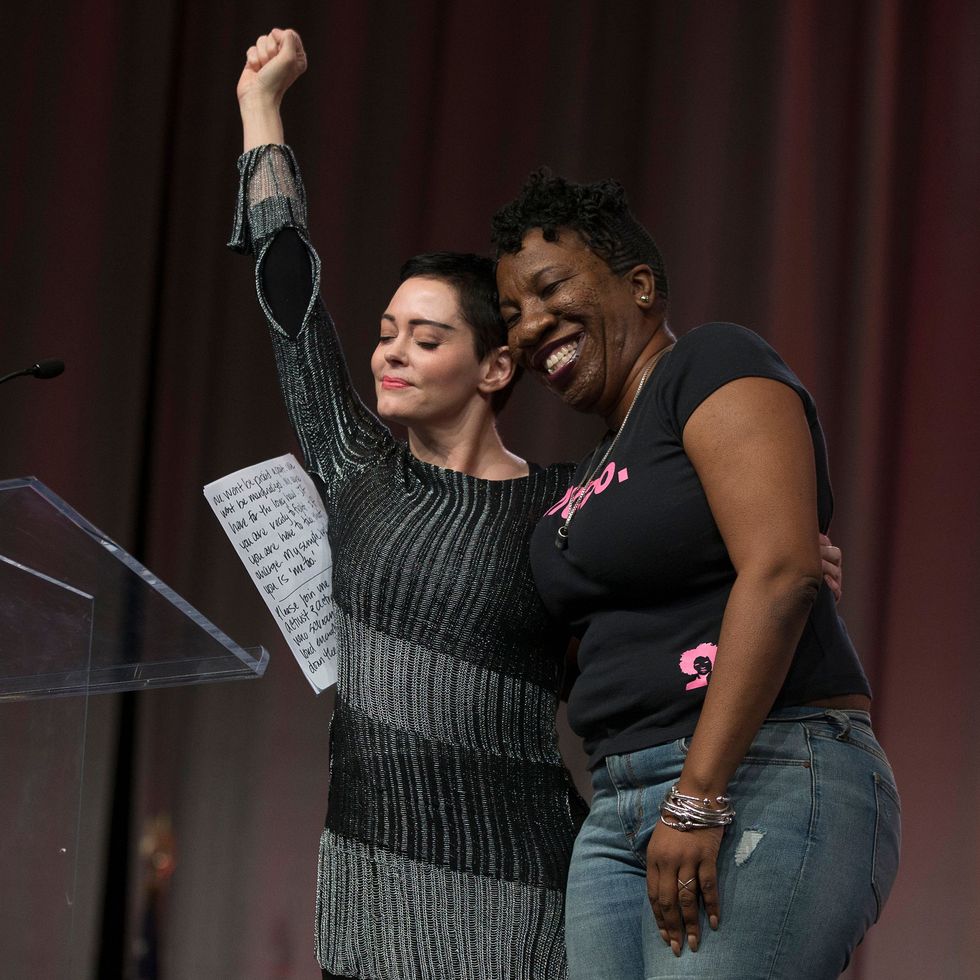 actor rose mcgowan and founder of metoo campaign tarana burke, embrace on stage at the womens march  womens convention in detroit, michigan, on october 27, 2017   afp photo  rena laverty        photo credit should read rena lavertyafp via getty images