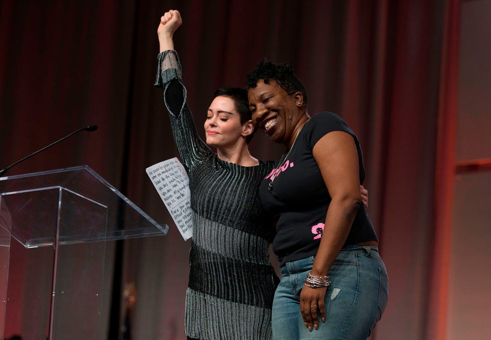 actor rose mcgowan and founder of metoo campaign tarana burke, embrace on stage at the womens march  womens convention in detroit, michigan, on october 27, 2017   afp photo  rena laverty        photo credit should read rena lavertyafp via getty images