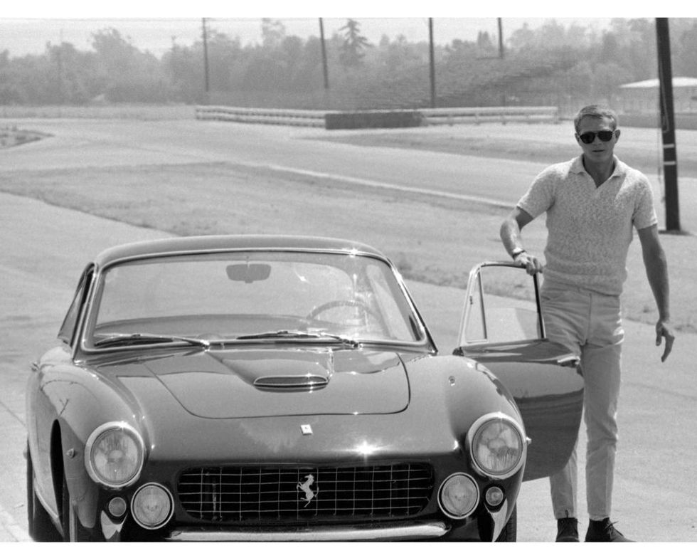 view of american actor steve mcqueen 1930 1980 as he stands beside the open door of a ferrari lusso 250 berlinetta, late 1960s photo by silver screen collectiongetty images