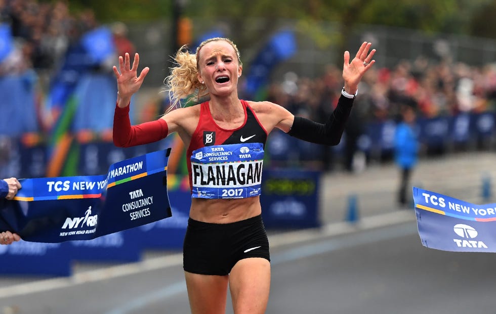 topshot shalane flanagan of the us celebrates after crossing the finish line to win the womens division during the 2017 tcs new york city marathon in new york on november 5, 2017 five days after the worst attack on new york since september 11, 2001, the city is staging a show of defiance on november 5, as 50,000 runners from around the world are set to participate in the new york marathon, under heavy security afp photo timothy a clary photo credit should read timothy a claryafp via getty images