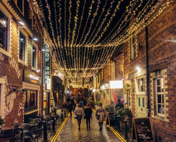 glasgow, scotland, uk   people on a night out in ashton lane, a sidestreet off byres road full of bars and restaurants