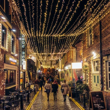 glasgow, scotland, uk   people on a night out in ashton lane, a sidestreet off byres road full of bars and restaurants