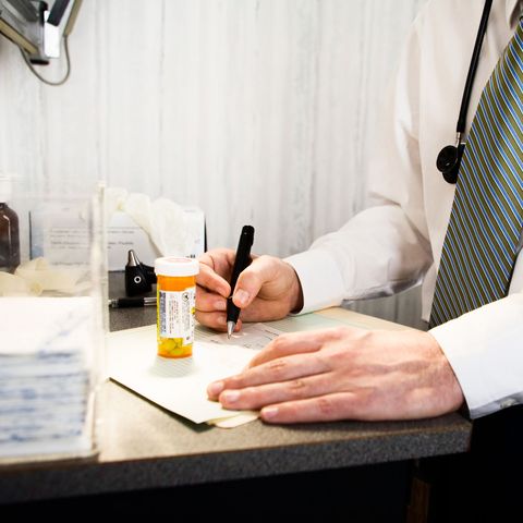 doctor writing prescription