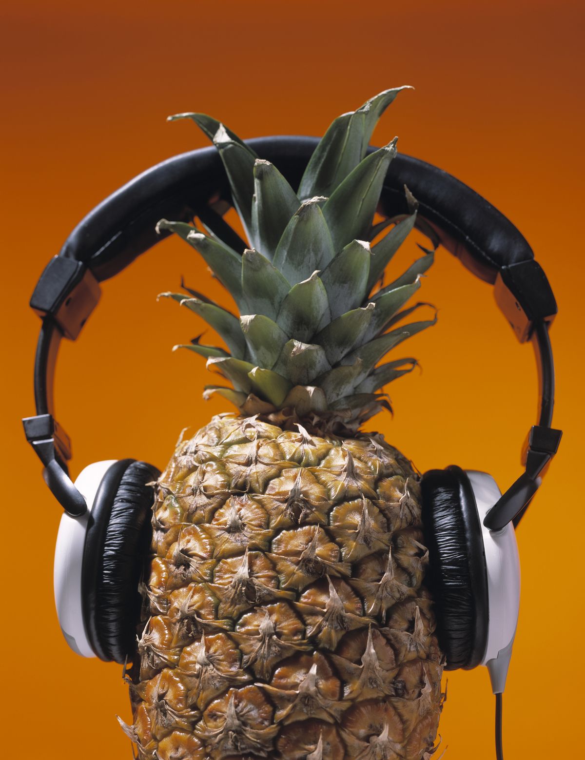 delicious pineapple wearing headphones