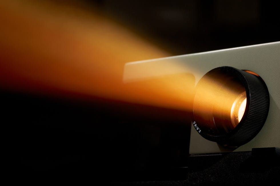 projector light beam shining bright in dark background
