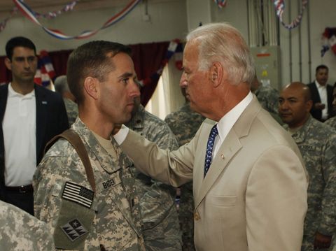 us vice president joe biden r talks with his son, us army capt beau biden l at camp victory on the outskirts of baghdad on july 4, 2009  biden said that americas role in iraq was switching from deep military engagement to one of diplomatic support, ahead of a complete withdrawal from the country in 2011 afp photo khalid mohammed pool photo credit should read khalid mohammedafp via getty images